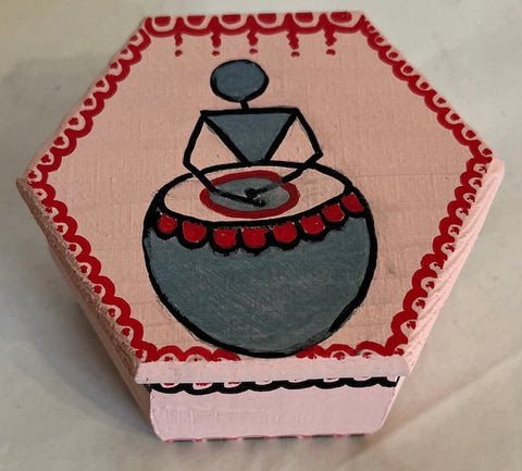 A pink hexagon warli wood box