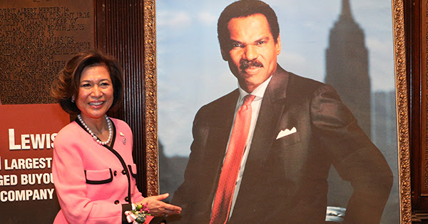 Loida Lewis with a photo of her late husband, Reginald F Lewis