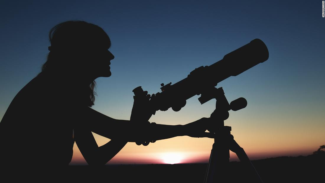 Person with a telescope