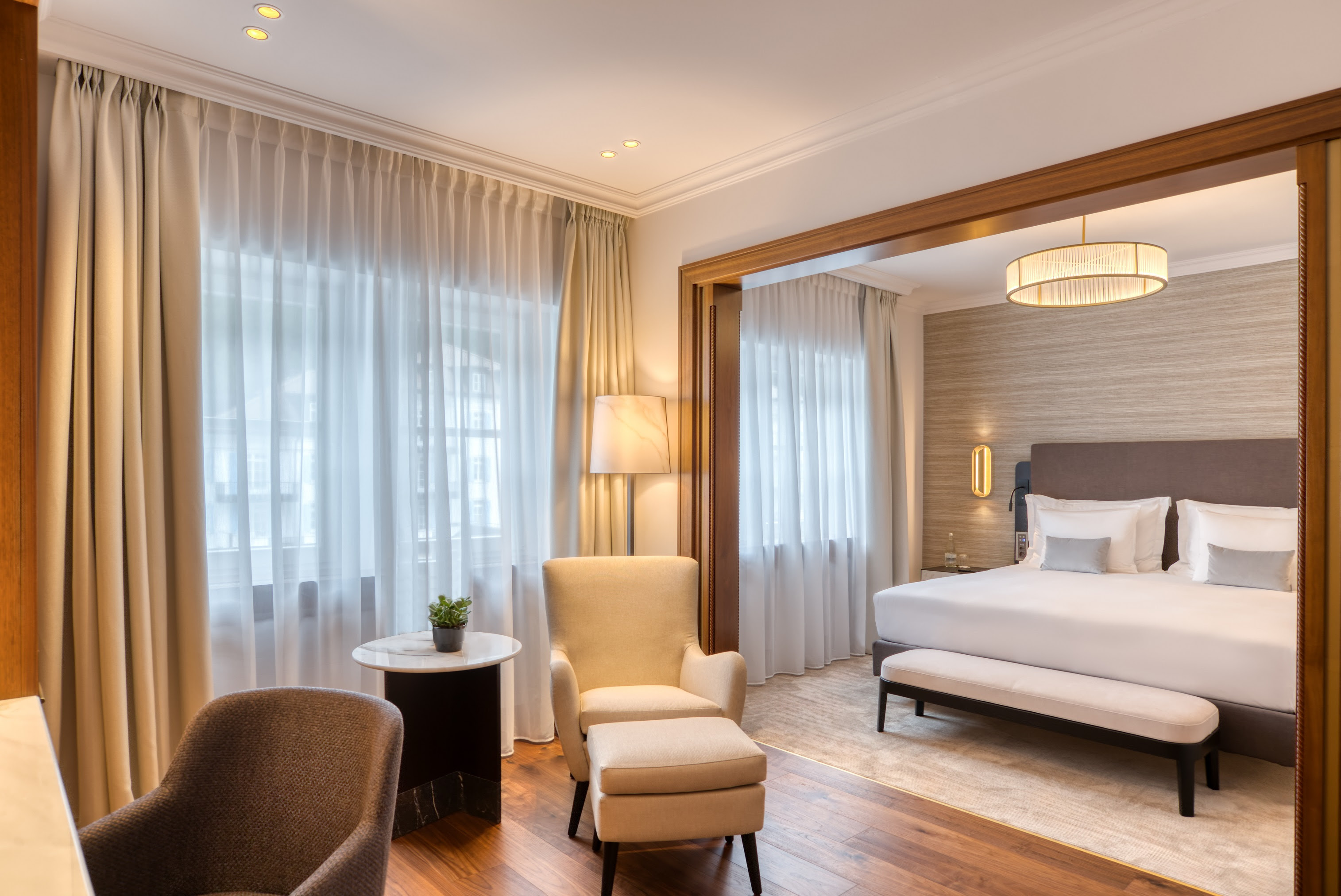 2. Grand Hotel des Bains Kempinski St. Moritz _Deluxe Room new_Livingroom _ Bedroom_copyright Kempinski Hotels.jpg
