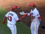 Washington Nationals&#39; Starlin Castro (13) celebrates his two-run home run with Juan Soto (22) during the sixth inning of a baseball game against the Tampa Bay Rays, Wednesday, June 30, 2021, in Washington. The Nationals won 15-6. (AP Photo/Nick Wass)