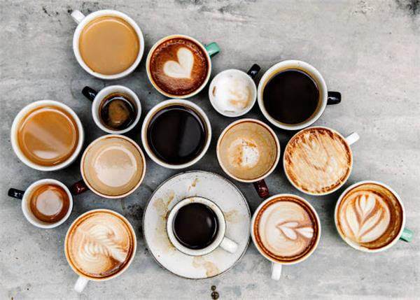 Multiple cups of different kinds of coffee viewed from overhead