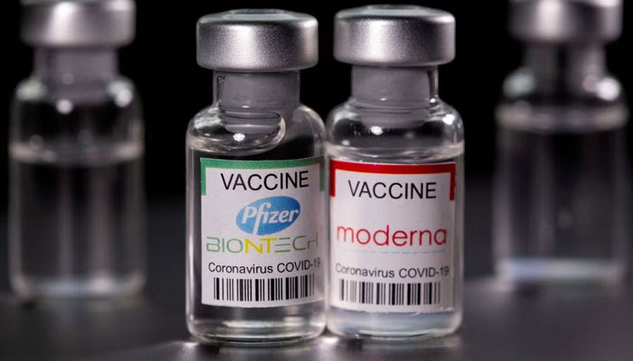 Vials with Pfizer-BioNTech and Moderna coronavirus disease (COVID-19) vaccine labels are seen in this illustration picture taken March 19, 2021. — Reuters
