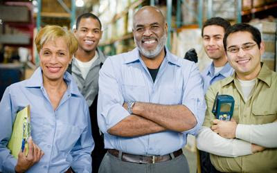 several happy workers in a warehouse