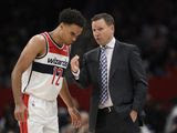 Washington Wizards head coach Scott Brooks talks with guard Jerome Robinson (12) during the second half of an NBA basketball game against the Atlanta Hawks, Friday, March 6, 2020, in Washington. The Wizards won 118-112. (AP Photo/Nick Wass) **FILE**