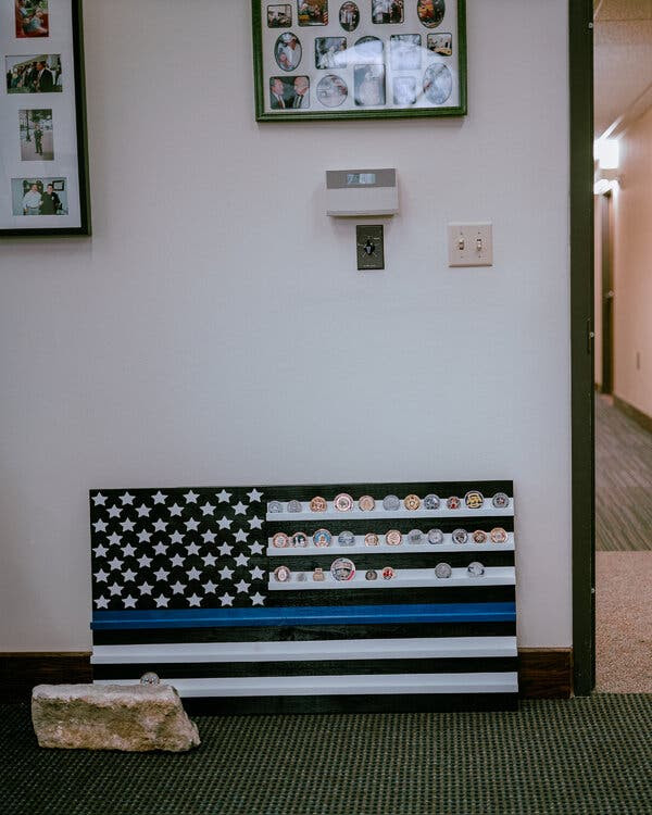 A
Thin Blue Line flag, a symbol of solidarity with
the police, at the Austin offices of Mr.
DeLord’s organization.