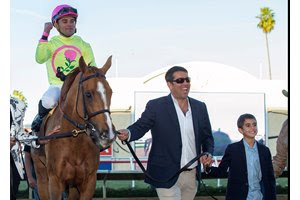 Sol Kumin leads Uni to the winner's circle after the Matriarch Stakes at Del Mar 