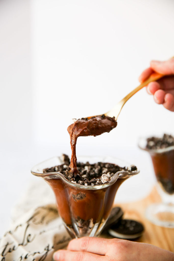 Cookies and Cream Chocolate Pudding being scooped with a spoon