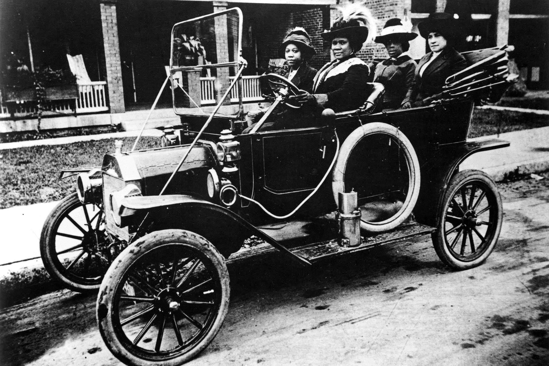 Madam C. J. Walker and companions in her Waverley electric automobile on West Street in Indianapolis in the 1910s. Madam C. J. Walker and companions in her Waverley electric automobile on West Street in Indianapolis in the 1910s.