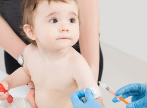 vaccine vaccination child baby doctor injection pediatrician injecting arm health immunization hand hospital needle syringe concept - stock image