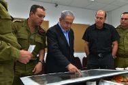 IDF officials brief Prime Minister Netanyahu on July 9, 2014. The prime minister visited wounded IDF soldiers Tuesau