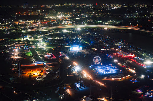 An aerial view of a city at nightDescription automatically generated