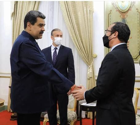 In this file photo, Energy Minister Stuart Young greets Venezuelan President Nicolas Maduro in Caracas in June 2022. -