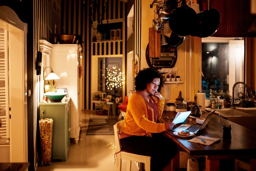 A woman working on her laptop. A woman working on her laptop.