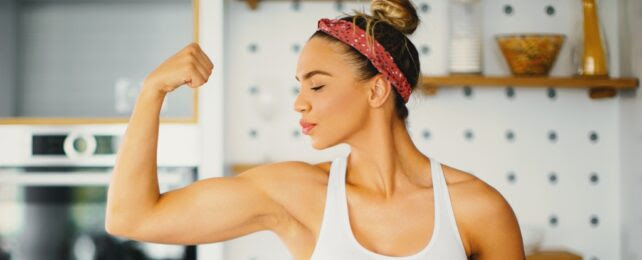 Strong Woman Flexes Bicep