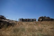 Israeli soldiers seen during patrol in the Golan Heights after a 15-year-old Israeli boy was killed Sunday morning, June 22, 2014. On July 13, another shell was fired into Israel from Syria.