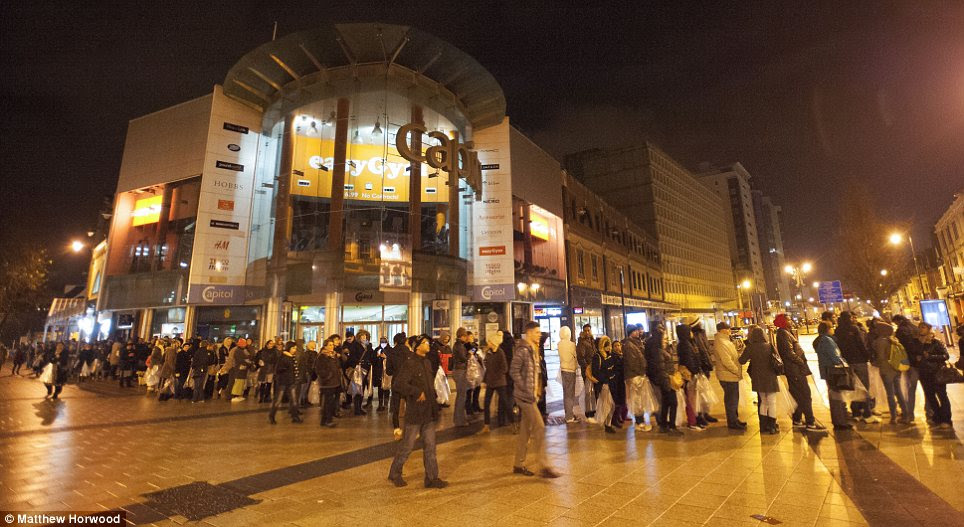 Queues: Nearly 2,000 shoppers stood in line in central  Cardiff  looking for bargains at the local branch of Next