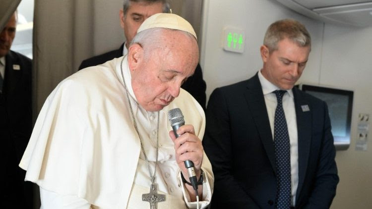 Pope Francis speaks to journalists aboard the papal plane