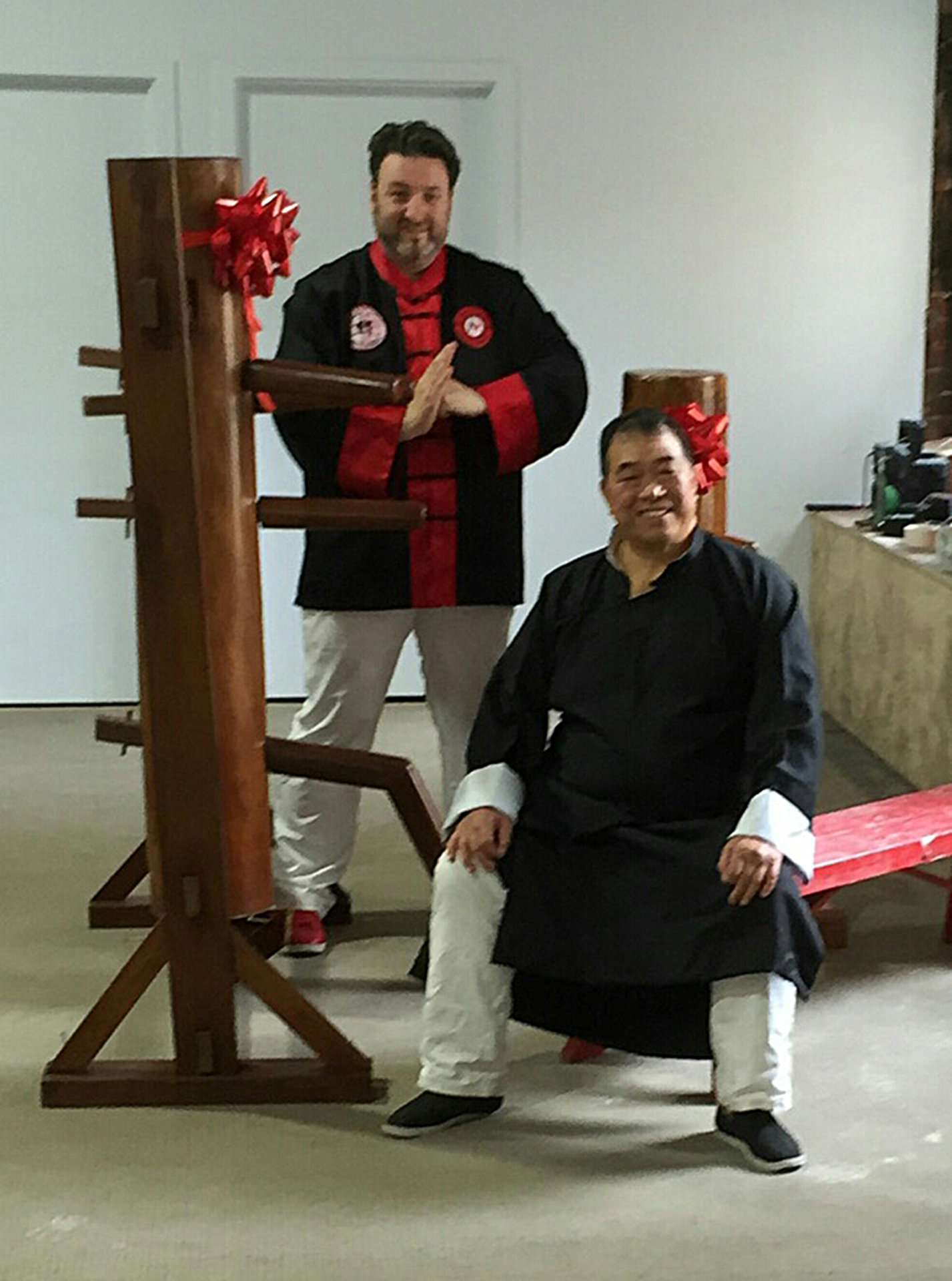 Maurice Novoa donating 2 wooden dummies to Felix Leong