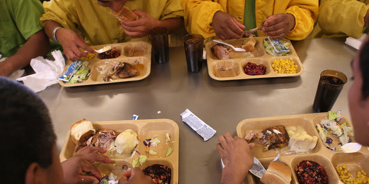 Detainees eat lunch at the Immigration and Customs Enforcement detention facility in Florence, Ariz., on Feb. 28, 2013. 