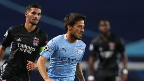 David Silva runs with the ball in the Champions League defeat by Lyon