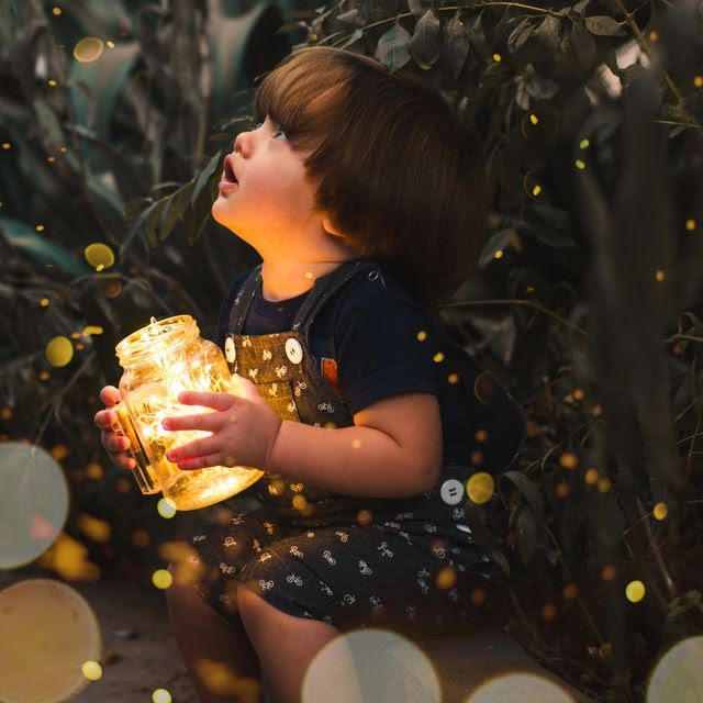 Girl with lamp waiting expectantly