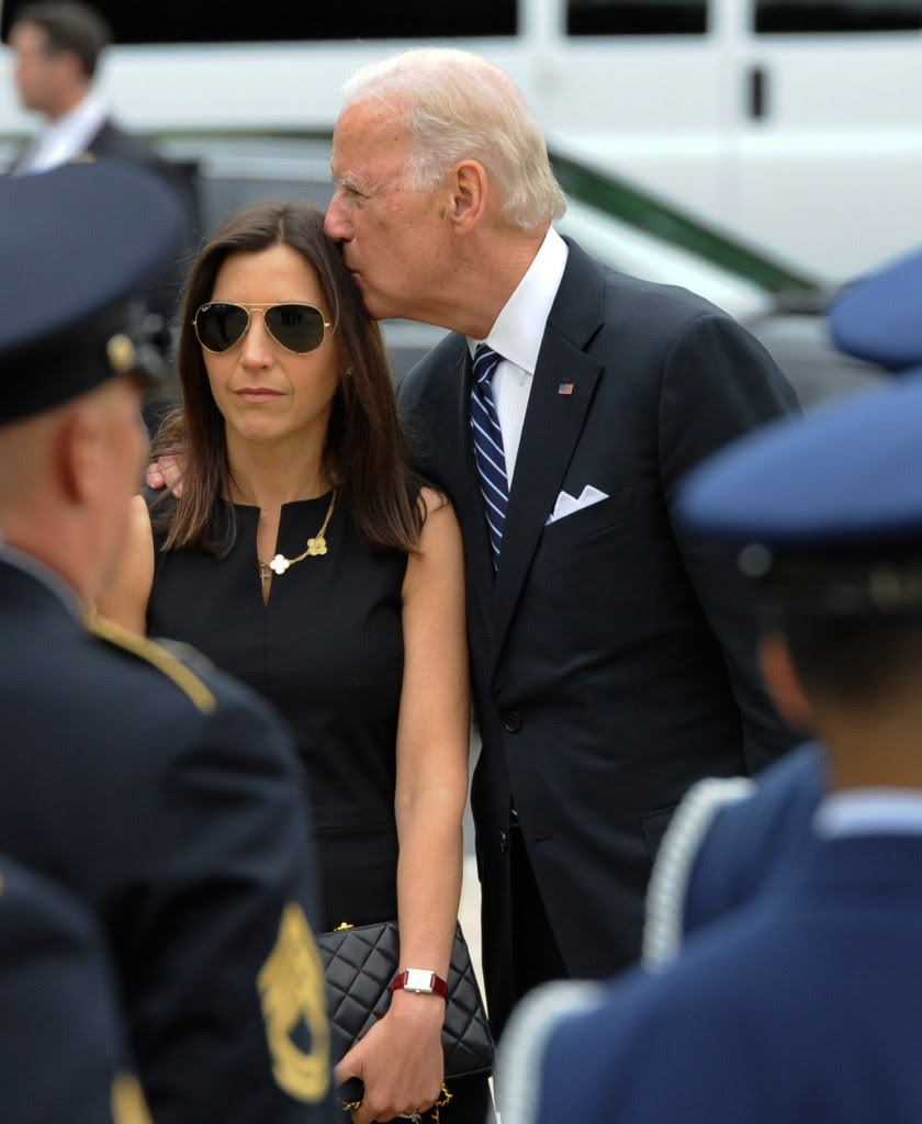Vice President Joe Biden consoles Hallie Biden .