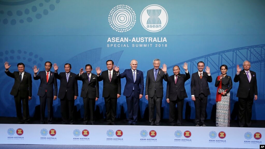 Leaders, from left to right; Prime Minister of Laos Thongloun Sisoulith, Indonesia's President Joko Widodo, Cambodia's Prime Minister Hun Sen, Brunei's Sultan Hassanal Bolkiah, Thailand's Prime Minister Prayuth Chanocha, Australia's Prime Minister Malcolm Turnbull, Singapore's Prime Minister Lee Hsien Loong, Vietnam's Prime Minister Nguyen Xuan Phuc, Philippines' Secretary of Foreign Affairs Alan Peter Cayetano, Myanmar's leader Aung San Suu Kyi, and Malaysia's Prime Minister Najib Razak, pose for a group photo at the Association of Southeast Asian Nations, ASEAN, special summit, in Sydney, Saturday, March 17, 2018. Australia is hosting leaders from the 10-country Association of Southeast Asian Nations during the 3-day special summit. (AP Photo/Rick Rycroft)