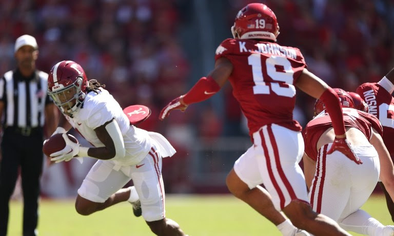 Alabama defensive back Kool-Aid McKinstry (1) runs the ball against Arkansas at Donald W. Reynolds Razorback Stadium in Fayetteville, AR on Saturday, Oct 1, 2022.