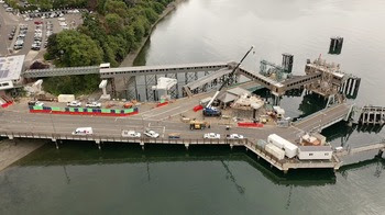 Aerial photo of Bainbridge terminal including a crane and concrete pillars alongside a wooden overhead walkway