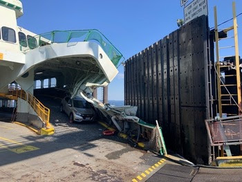 Damaged ferry at a dock