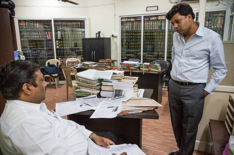 Nitin Mangal, right, at his lawyers’ office. Mr. Mangal said he was chained to a hotel bed during one night of a trip with police investigating his case.