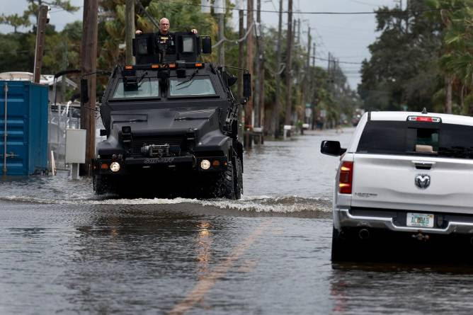 Cars in flooded streets from Hurricane Idalia