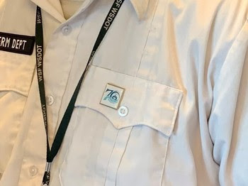 Photo of 70th anniversary pin on shirt of terminal employee