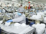 In this photo released by Xinhua News Agency, workers produce face masks in the workshop of a textile company in Jimo District of Qingdao in eastern China&#39;s Shandong Province on Wednesday, Feb. 12, 2020. Qingdao Municipal Bureau of Industry and Information Technology has mobilized two large textile companies to produce face masks to help the fight against the novel coronavirus epidemic. (Liang Xiaopeng/Xinhua via AP)