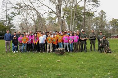 Group photo of ECOs and volunteers near the woods