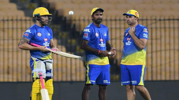 Chennai Super Kings coach Stephen Fleming with bowling coach L. Balaji and player Faf du Plessis during a practice session ahead of the IPL 2019 match against Mumbai Indians in Chennai. 