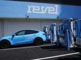 Chargers for electric cars are displayed at an opening ceremony for a Revel electric vehicle charging hub in the Brooklyn borough of New York, Tuesday, June 29, 2021. (AP Photo/Seth Wenig)