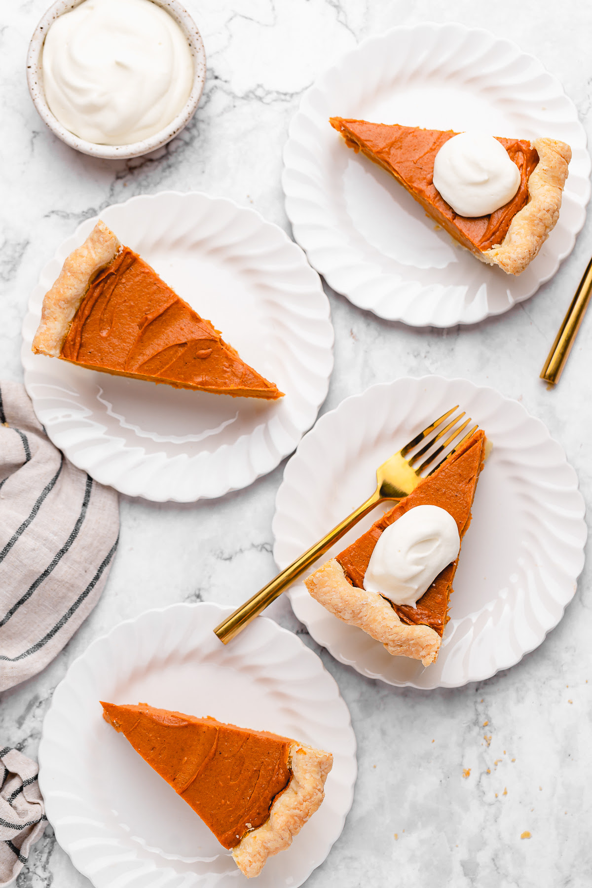 This Vegan Sweet Potato Pie is just like the Southern classic, but made without the dairy and eggs. Sweet, creamy, and perfect! Overhead view of vegan sweet potato pie slices on plates