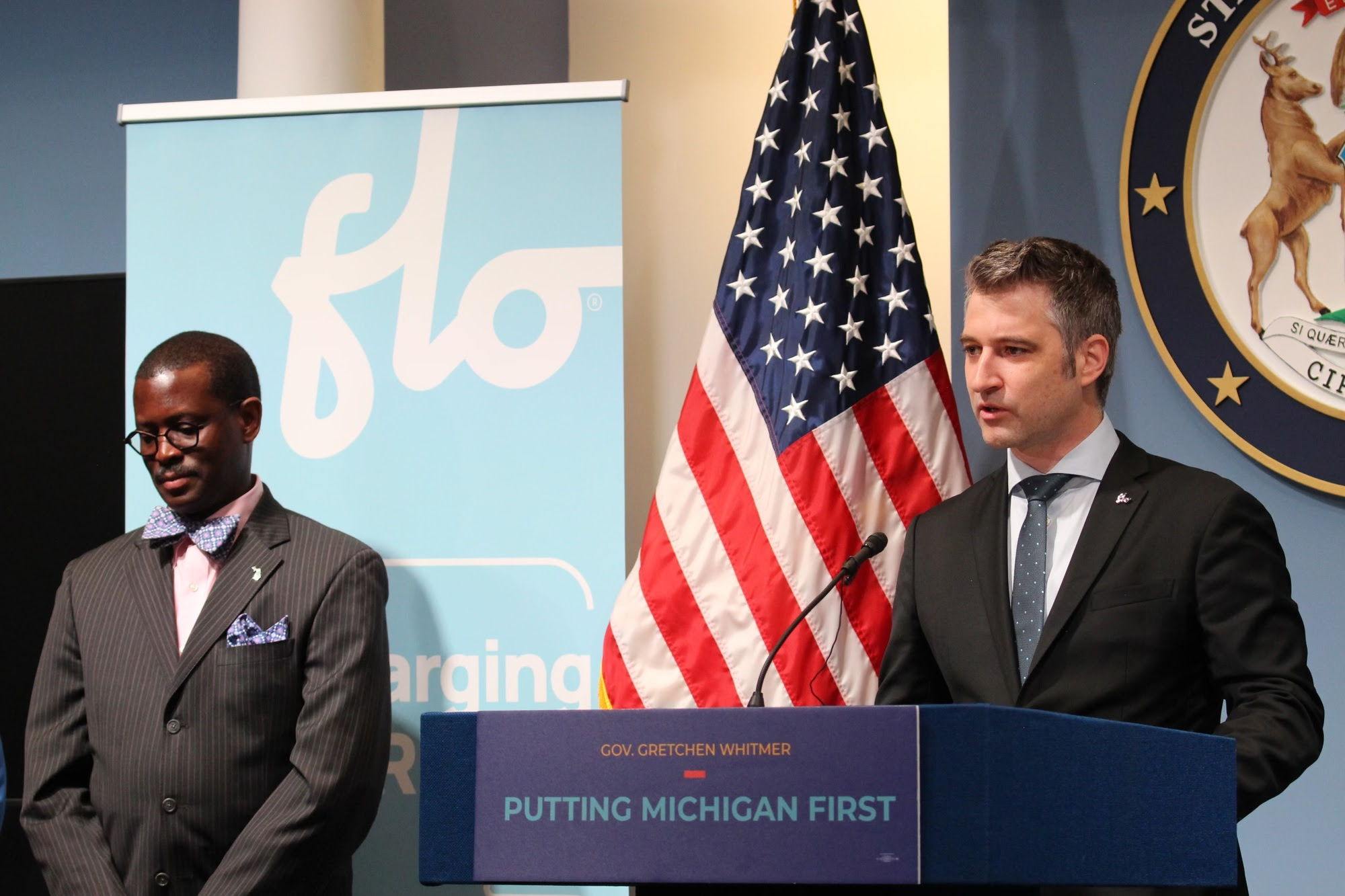 CEO of FLO speaks at podium during the event 