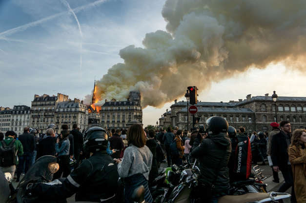 Slide 1 of 31: Smokes and flames rise during a fire at Notre-Dame Cathedral in central Paris, France, on April 15, 2019.- A fire broke out at the landmark Notre-Dame Cathedral in central Paris, potentially involving renovation works being carried out at the site, the fire service said. (Photo by Nicolas Liponne/NurPhoto via Getty Images)