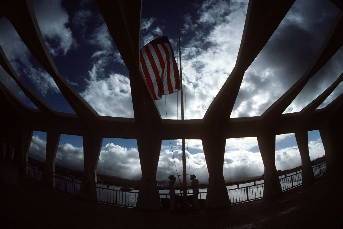 USS Arizona memorial with the American flag raised above