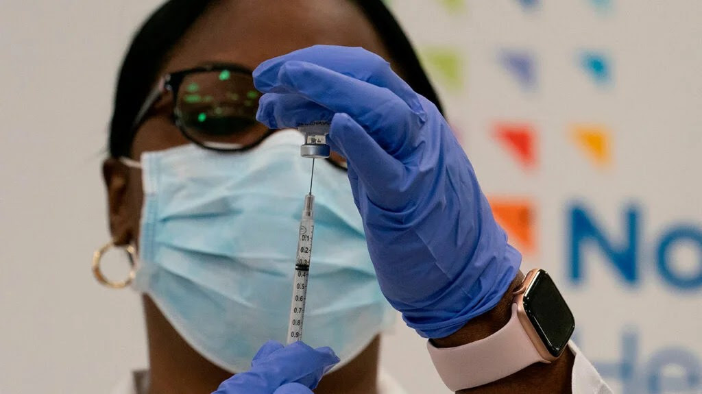 Healthcare professional preparing a vaccine shot