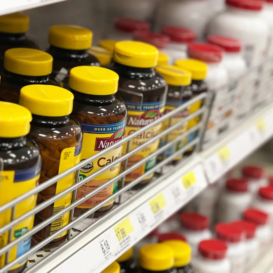 bottles of vitamins on store shelves