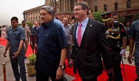 Defense Secretary Ashton Carter walks with Indian Defense Minister Manohar Parrikar after receiving a ceremonial welcome in New Delhi. Mr. Carter signed a 10-year agreement with India seen by some as a move to counter China&#39;s growing influence. (Associated Press)