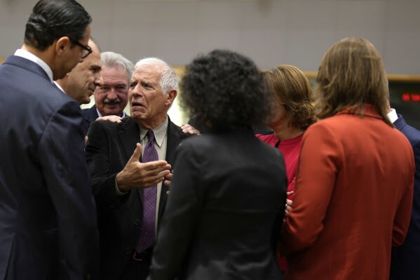 European Union foreign policy chief Josep Borrell, fourth left, speaks with from left, Cypriot Foreign Minister Constantinos Kombos, Greece's Foreign Minister Giorgos Gerapetritis, Luxembourg's Foreign Minister Jean Asselborn, Belgium's Foreign Minister Hadja Lahbib and Netherland's Foreign Minister Hanke Bruins Slot during a meeting of EU foreign ministers at the European Council building in Brussels, Monday, Nov. 13, 2023. European Union foreign ministers gather Monday to discuss the war in Ukraine and the situation in Israel and Gaza. (AP Photo/Virginia Mayo)