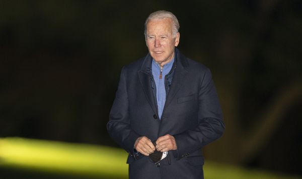 President Joe Biden walks on the South Lawn as he arrives at the White House early Wednesday, Nov. 3, 2021 in Washington from a European trip. (AP Photo/Manuel Balce Ceneta)