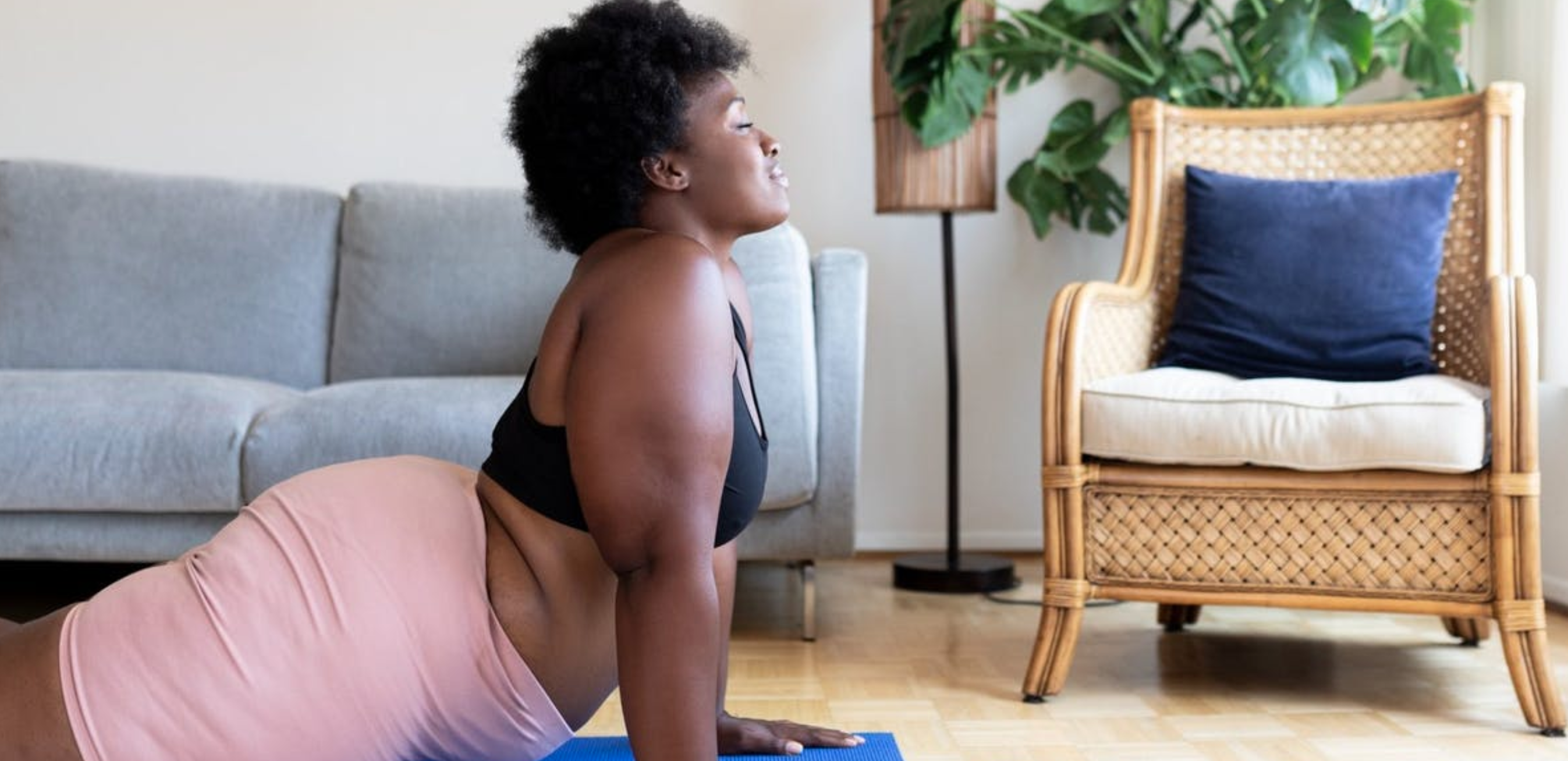 a woman stretching on a yoga mat