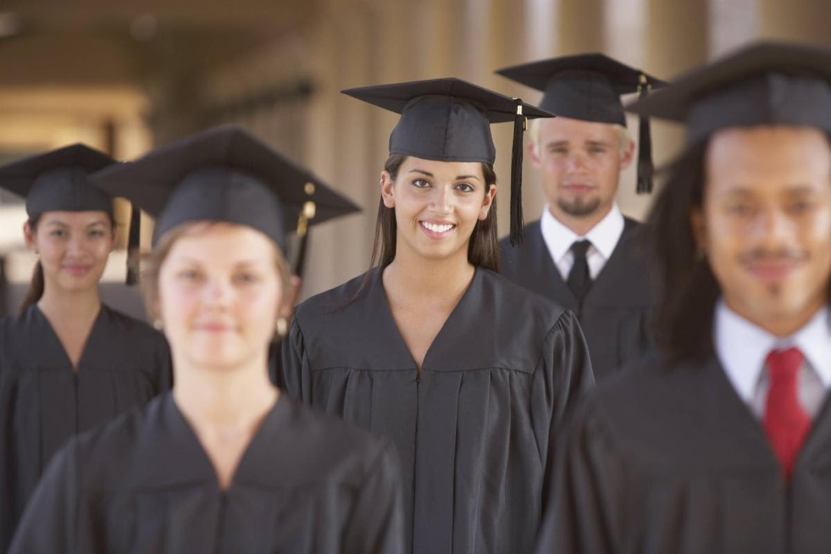 high school students in graduation caps and gowns