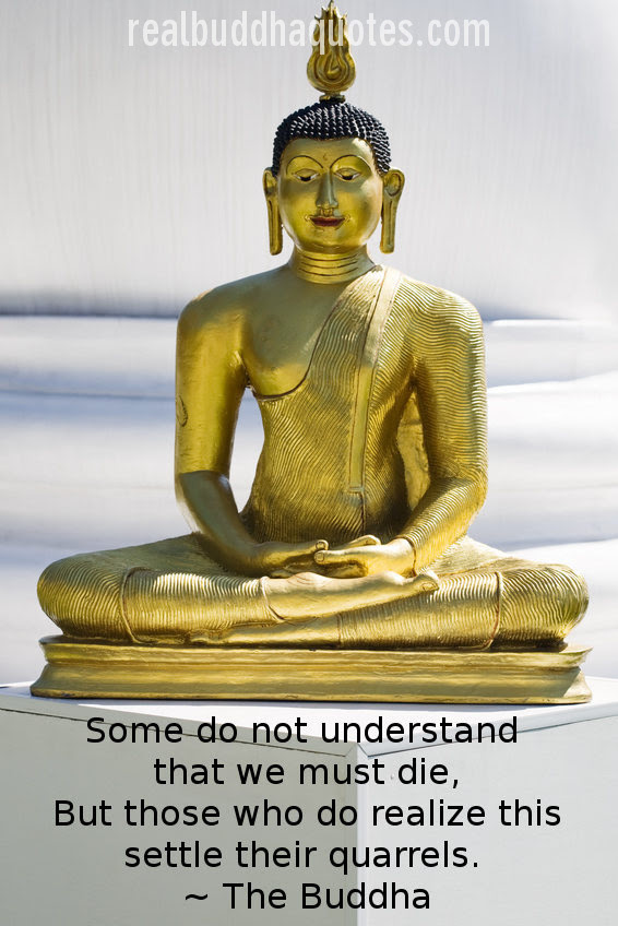 Golden statue of seated Buddha in lotus position